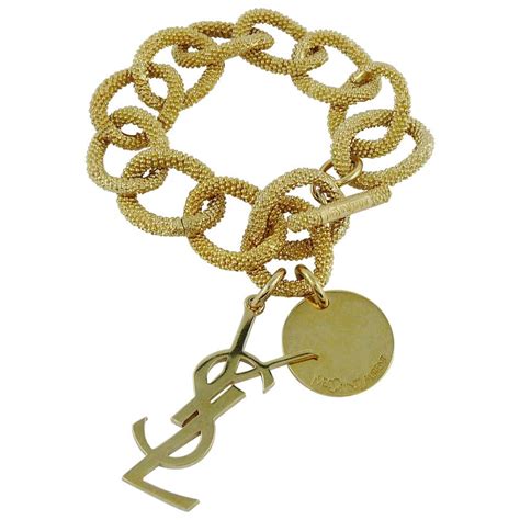 ysl charm bracelet gold|YSL interlocking bracelet.